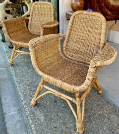 Louis Sognot Louis Sognot refined pair of rattan arm chairs in good vintage condition - 3099924