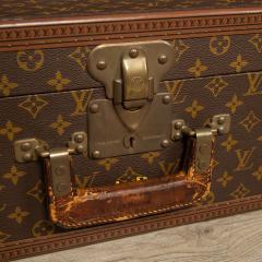 Monogram canvas and leather suitcase LOUIS VUITTON with …