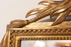 Louis XVI Style Gilt Wood Mirror with Floral Carved Medallion Crest and Tassels - 3707054