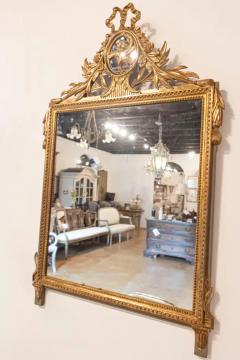 Louis XVI Style Gilt Wood Mirror with Floral Carved Medallion Crest and Tassels - 3707107