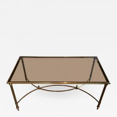 MID CENTURY BRASS SMOKED GLASS COFFEE TABLE WITH CURVED STRETCHER - 798095