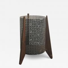 MID CENTURY PERFORATED METAL AND WOOD THREE LEGGED TRASH CANNISTER - 4279215