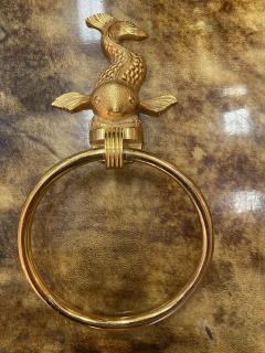 MID CENTURY TRIO OF GOLD PLATED BRASS DOLPHINS AND MERMAID TOWEL RINGS - 2540324
