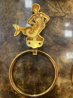 MID CENTURY TRIO OF GOLD PLATED BRASS DOLPHINS AND MERMAID TOWEL RINGS - 2540329