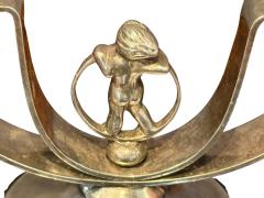 MODERNIST PAIR OF ART DECO SILVERED CANDELABRA WITH STYLIZED CHERUB IN RING - 4608000