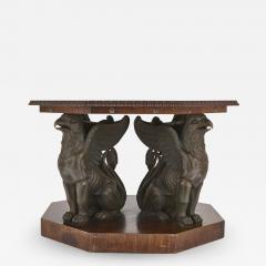 Mahogany octagonal table with bronzed metal griffins - 1579236
