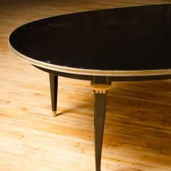 Maison Jansen A large oval ebonized and bronze mounted dining room table by Jansen circa 1945 - 1739199