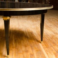 Maison Jansen A large oval ebonized and bronze mounted dining room table by Jansen circa 1945 - 1739213