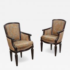 Mariano Fortuny Pair of Fortuny Louis XVI Style Parcel Gilt Ebonized Arm Chairs - 4256538