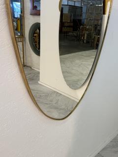 Mid Century Brass Framed Shield Form Wall Mirror - 4291997
