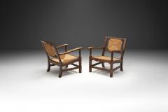 Mid Century Handcrafted Wood and Woven Straw Armchairs Europe ca 1950s - 2787021
