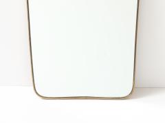 Mid Century Italian Modernist Shaped Brass Mirror with Scroll Crest - 4754047