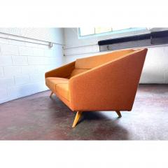 Mid Century Orange Sofa with Maple Legs - 1692085