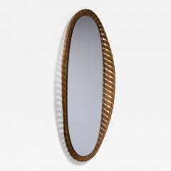 Oval wall mirror with a wooden and rattan frame - 2832810