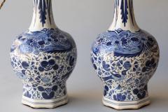 PAIR OF DUTCH DELFT BLUE AND WHITE WAISTED BOTTLE VASES CONVERTED TO LAMPS - 4574789