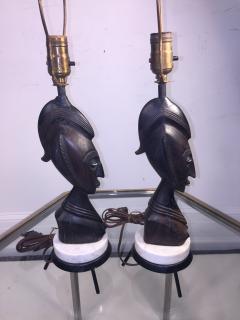 PAIR OF MID CENTURY CARVED WOOD AFRICAN BUST ON TRIPOD MARBLE BASE LAMPS - 771597