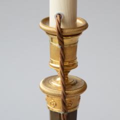 PAIR OF RESTAURATION PERIOD GILT AND PATINATED BRONZE CANDLESTICKS - 3550747