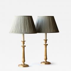 PAIR OF RESTAURATION PERIOD GILT BRONZE CANDLESTICKS CONVERTED TO TABLE LAMPS - 3552715