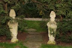 PAIR OF TALL CARVED STONE FLAME FINIALS - 3632220