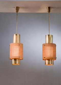 Paavo Tynell Pair of Paavo Tynell brass and wood pendant lamps - 2499507