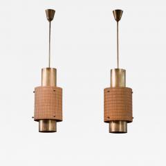 Paavo Tynell Pair of Paavo Tynell brass and wood pendant lamps - 2502414