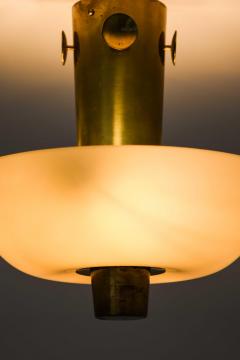 Paavo Tynell Scandinavian Modern Ceiling Lamp in Brass Opaline Glass by Paavo Tynell 1950s - 4736431