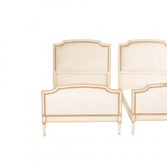 Painted twin beds with nail head upholstered headboard and foot board - 1886190