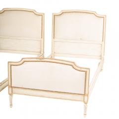 Painted twin beds with nail head upholstered headboard and foot board - 1886194