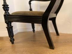 Pair of Anglo Indian Carved Ebony and Caned Armchairs - 2310900