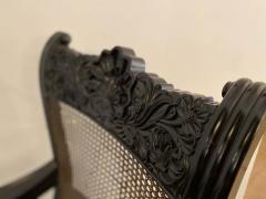 Pair of Anglo Indian Carved Ebony and Caned Armchairs - 2310910