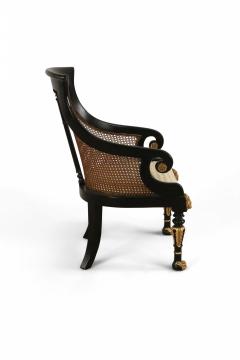 Pair of English Regency Style Carved Black and Giltwood Cane Back Armchairs - 2798297