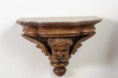 Pair of French 1880s Carved Walnut Brackets with Cherubs and Faux Marble Tops - 3432925