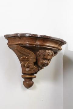 Pair of French 1880s Carved Walnut Brackets with Cherubs and Faux Marble Tops - 3432934