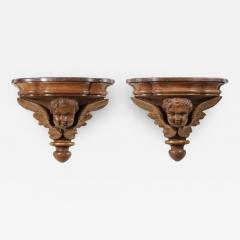 Pair of French 1880s Carved Walnut Brackets with Cherubs and Faux Marble Tops - 3435305