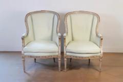 Pair of French Louis XVI Style 1900s Painted and Parcel Gilt Berg res Chairs - 3722386