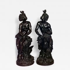 Pair of Moreau French Victorian bronze seated nubian figures with feathers in ha - 4630867