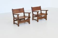 Pair of Spanish brutalist lounge chairs oak and saddle leather Spain 1960 - 3990738