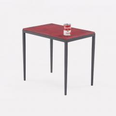 Pair of iron and deep red leather end tables in the manner of Jean Michel Frank  - 3702535