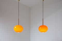 Pair of pendant chandeliers with wooden stem and red blown glass diffuser - 2434530