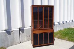 Paul McCobb Tall Cabinet with Glass Doors Leather Panels by Paul McCobb for H Sacks - 125045
