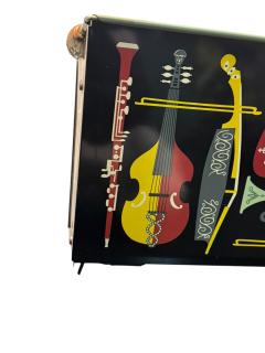 Piero Fornasetti MID CENTURY MUSICAL INSTRUMENT ENAMELED METAL MAGAZINE RACK FORNASETTI STYLE - 4409743