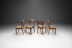 Pierre Cru ge A Set of Four Dining Chairs with Woven Seats by Pierre Cru ge France ca 1950s - 3949242