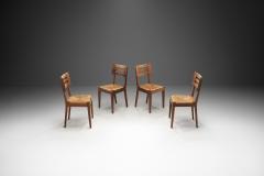 Pierre Cru ge A Set of Four Dining Chairs with Woven Seats by Pierre Cru ge France ca 1950s - 3949244