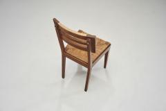 Pierre Cru ge A Set of Four Dining Chairs with Woven Seats by Pierre Cru ge France ca 1950s - 3949246