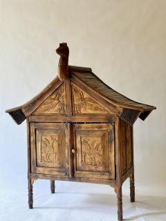 Rare and primitive Sumatran 2 Drawer Cabinet with Bird Carvings on all 4 Sides - 4367308