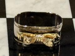 SET OF EIGHT SIVERPLATE GOLDTONE BOW DESIGN NAPKIN RINGS - 4557670