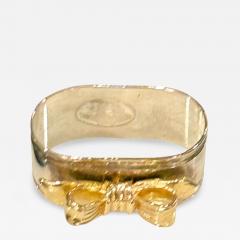 SET OF EIGHT SIVERPLATE GOLDTONE BOW DESIGN NAPKIN RINGS - 4559046