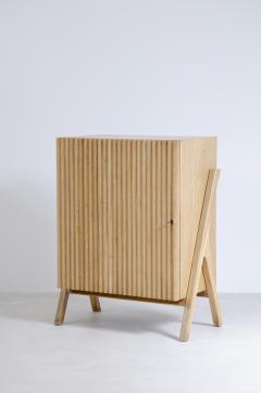 Small storage unit in light oak with ribbed wood front  - 2416132