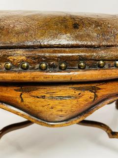 The leather shows wear and signs of repair  - 3235780