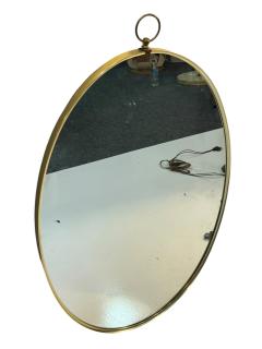 Tommi Parzinger MID CENTURY BRASS FRAMED OVAL MIRROR WITH RING IN THE MANNER OF TOMMI PARZINGER - 4695552